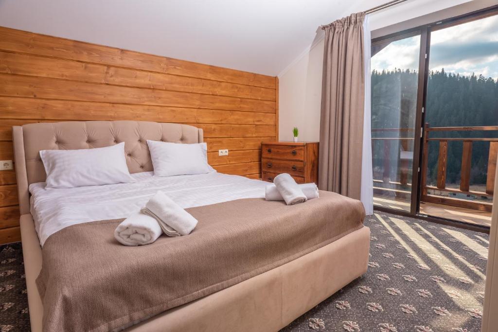Postel nebo postele na pokoji v ubytování Residence Chalet & Nesh