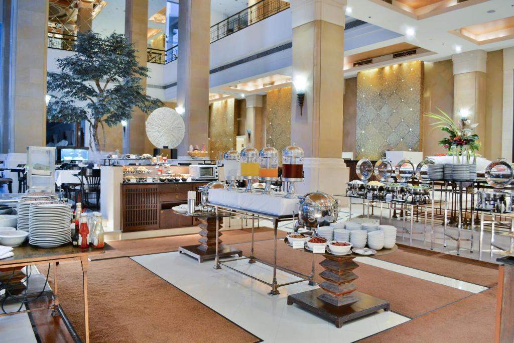 A bright buffet area set inside the hotel’s open lobby-style dining space.