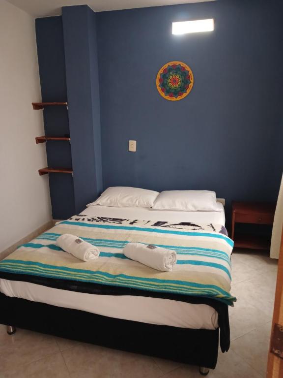 Postel nebo postele na pokoji v ubytování Hotel Lagos de Guatape