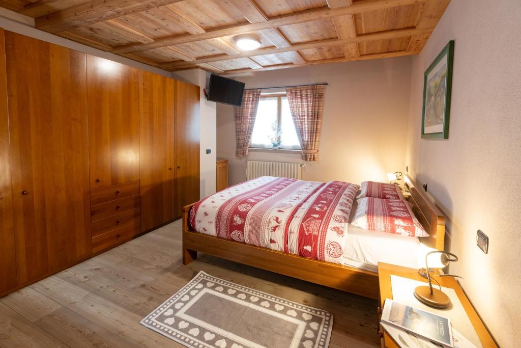 Postel nebo postele na pokoji v ubytování Taverna Larice