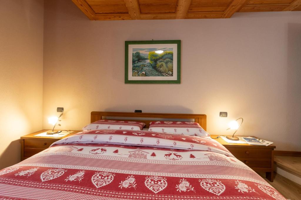 Postel nebo postele na pokoji v ubytování Taverna Larice