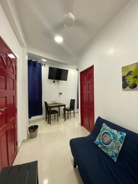 a living room with a couch and a table at Resting View One Bedroom Apartment in Male City