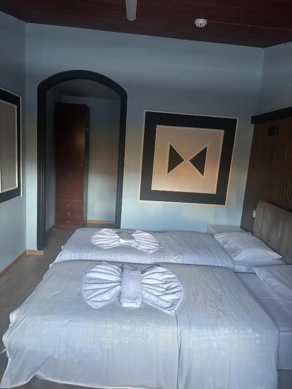 Postel nebo postele na pokoji v ubytování batummetropol hotel