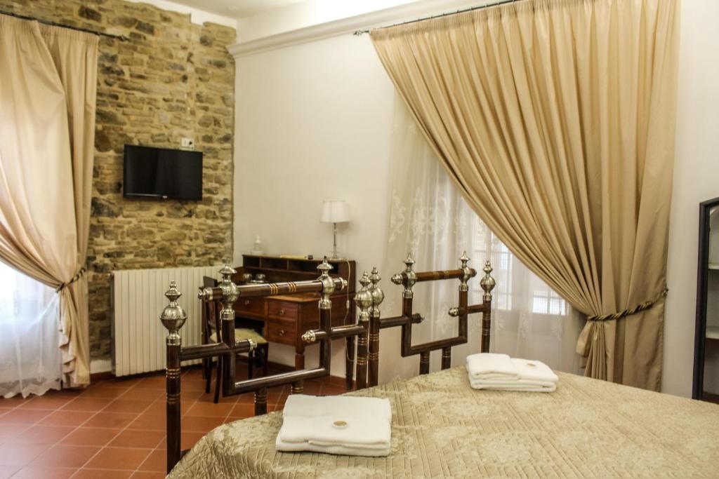 Postel nebo postele na pokoji v ubytování Castel di Pietra