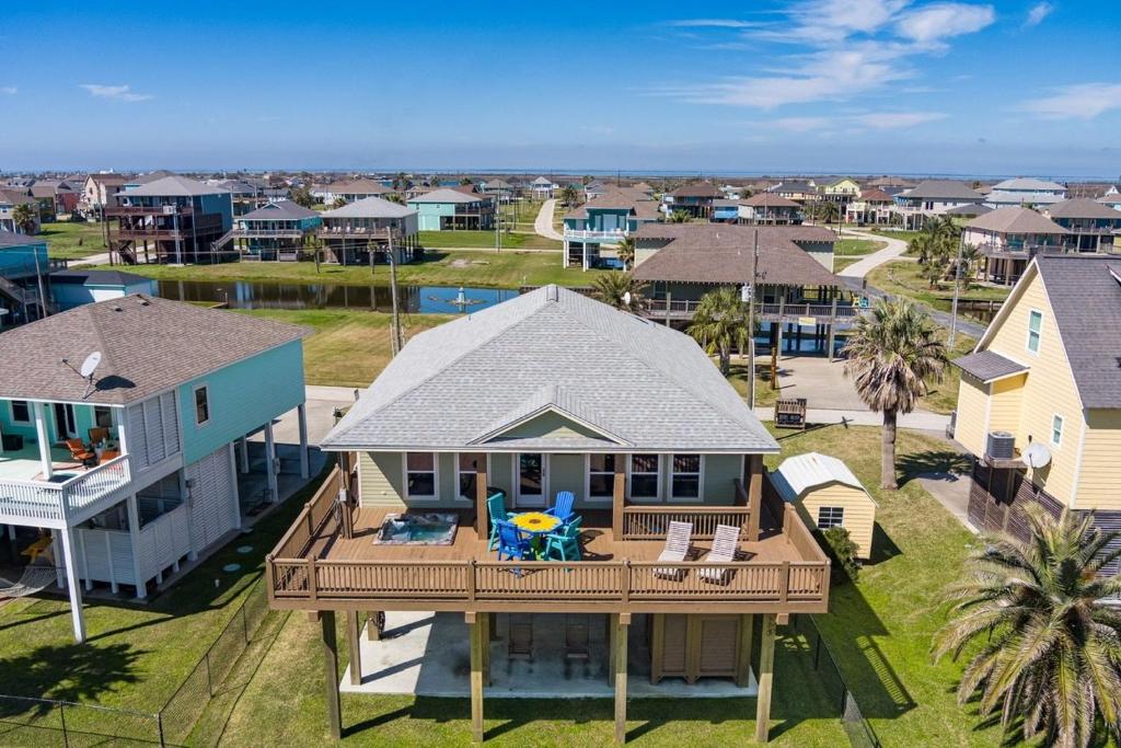 an aerial view of a house with a deck at Nauti By Nature home in Crystal Beach