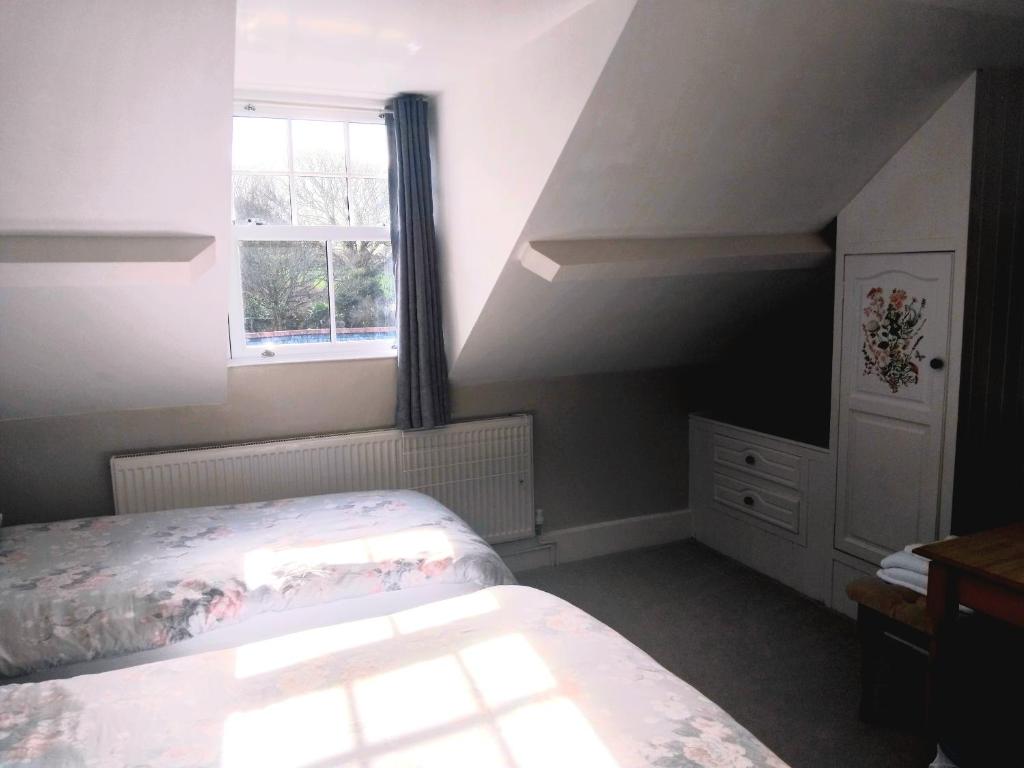 Postel nebo postele na pokoji v ubytování The Countryman Hotel