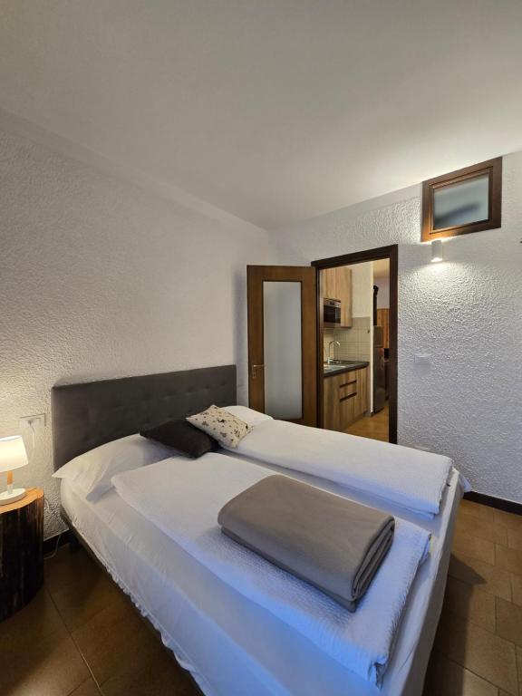A bed or beds in a room at bb26 apartment mountain Lozio