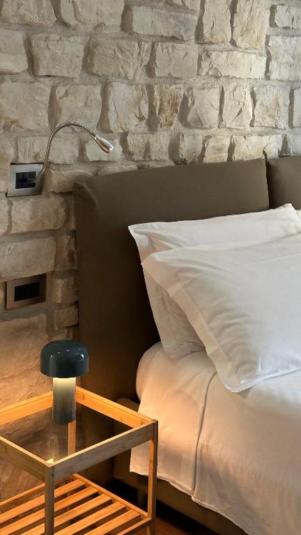 Łóżko lub łóżka w pokoju w obiekcie Olivia Rooms Eurialo