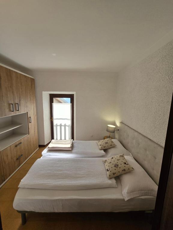 A bed or beds in a room at bb26 apartment mountain Lozio