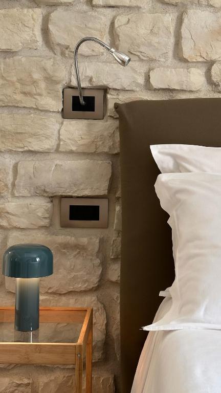 Łóżko lub łóżka w pokoju w obiekcie Olivia Rooms Eurialo