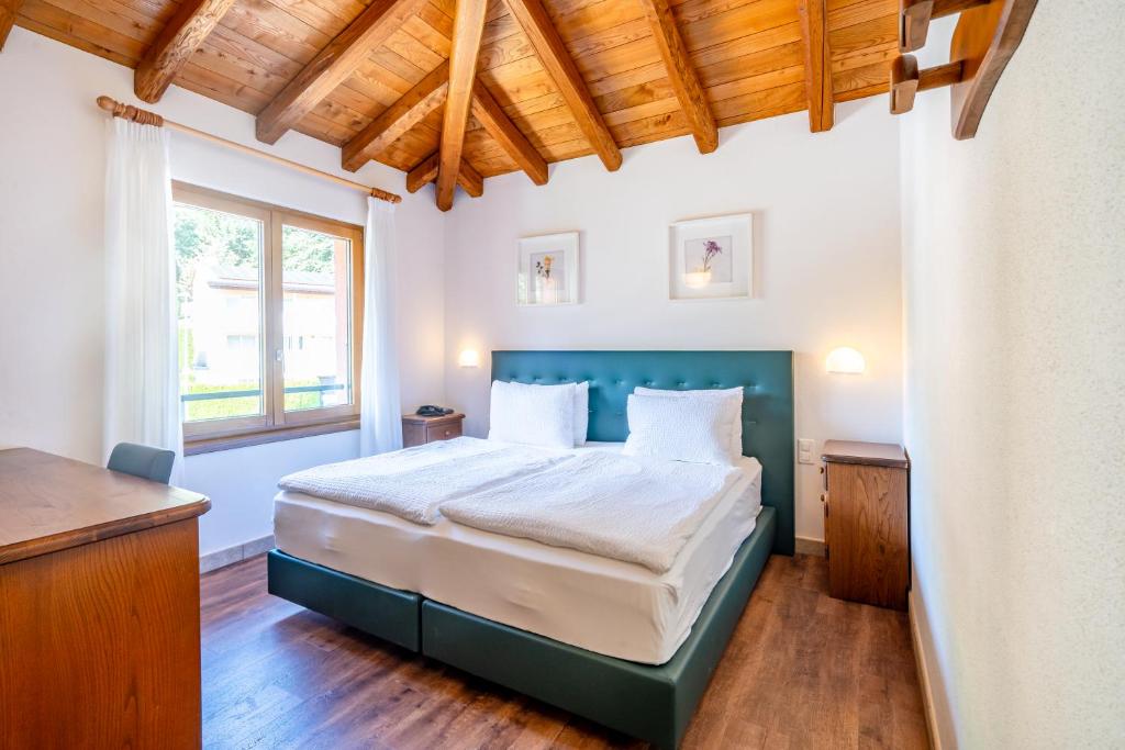 Postel nebo postele na pokoji v ubytování Hotel Il Castagno
