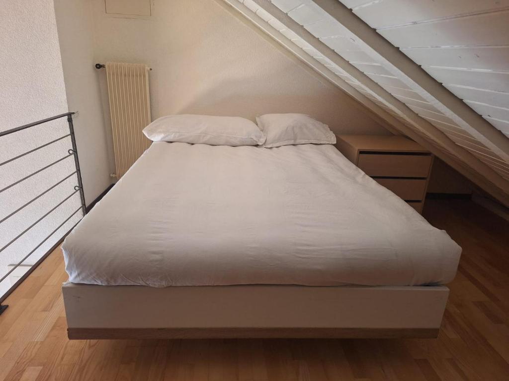 Postel nebo postele na pokoji v ubytování Casa Jean-Jacques Rousseau