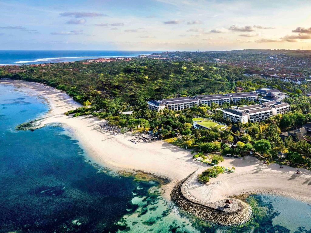 an aerial view of a beach and the ocean at Sofitel Bali Nusa Dua Beach Resort in Nusa Dua