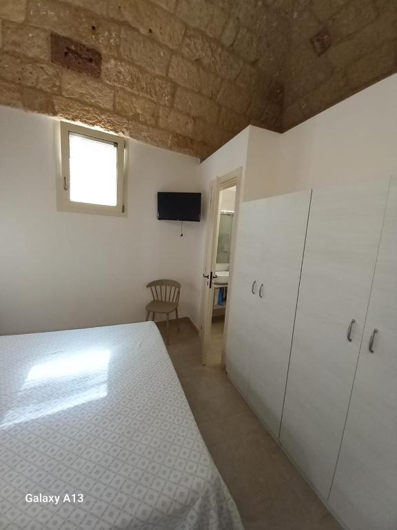 Postel nebo postele na pokoji v ubytování TORRE SUL MARE affittacamere Ugento
