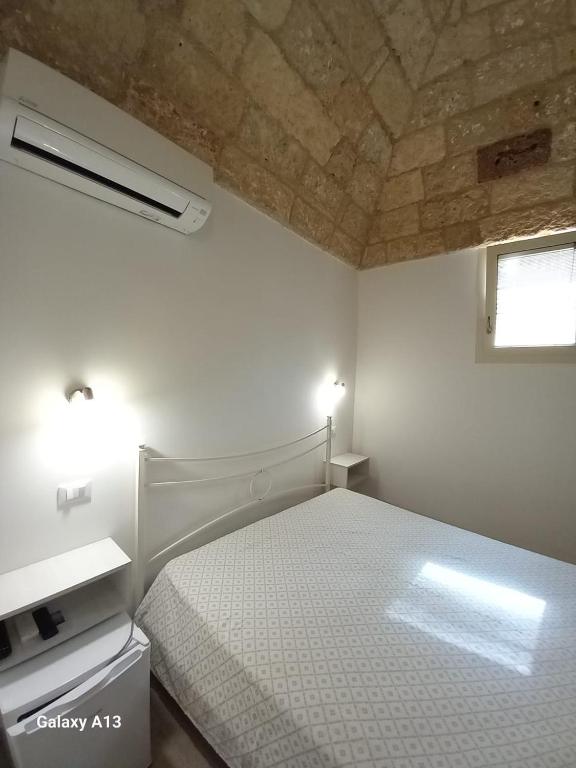 Postel nebo postele na pokoji v ubytování TORRE SUL MARE affittacamere Ugento
