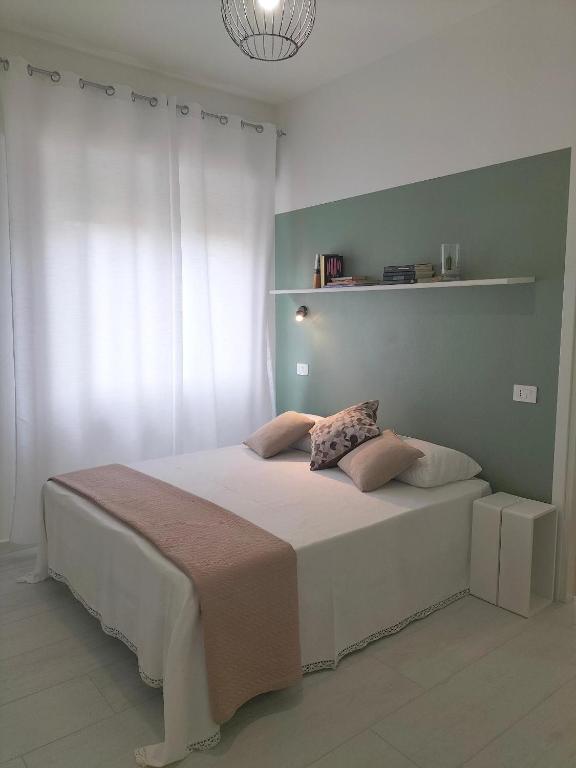 Postel nebo postele na pokoji v ubytování Lugore Room