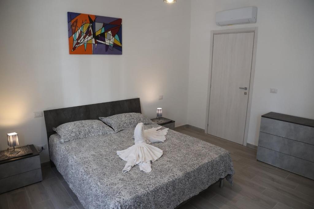 Postel nebo postele na pokoji v ubytování Sognare in Puglia