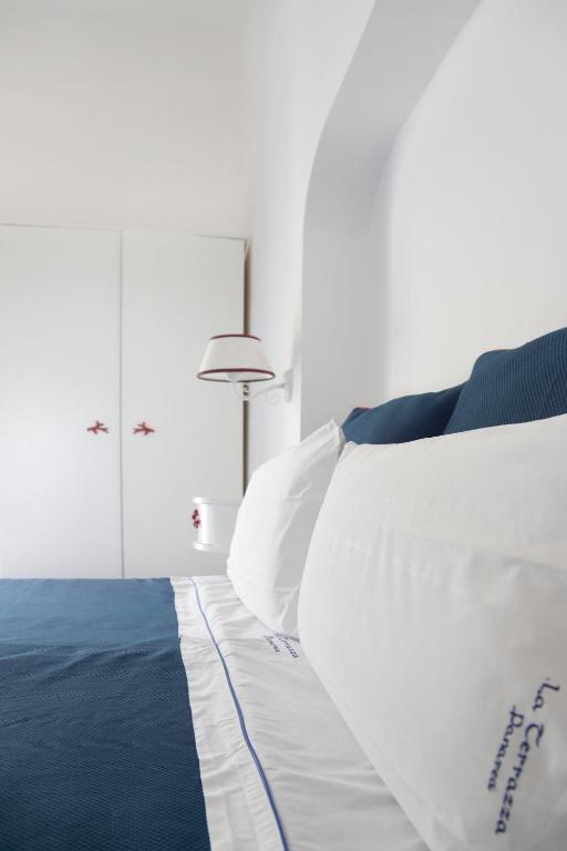 Postel nebo postele na pokoji v ubytování Hotel La Terrazza