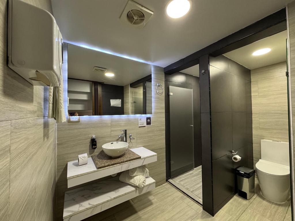 Koupelna v ubytování Hotel American Visa Normandia