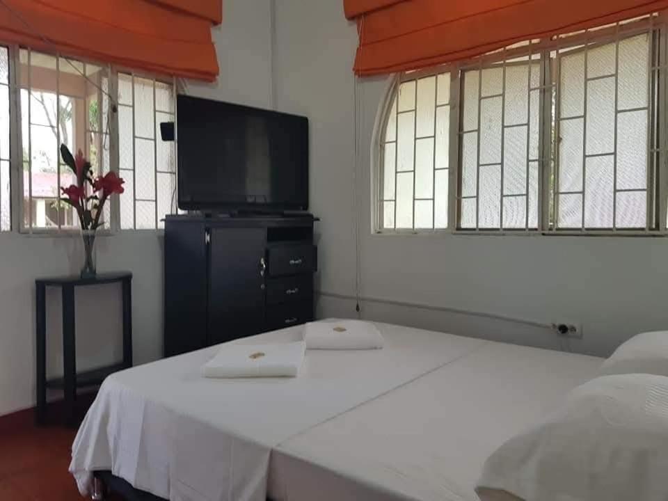 Postel nebo postele na pokoji v ubytování FiNCA TURISTICA LOS NARANJITOS