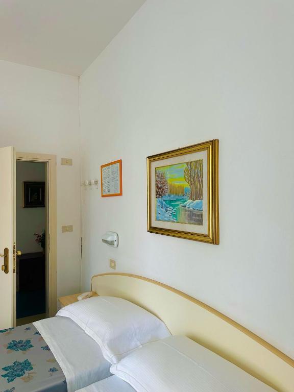 Postel nebo postele na pokoji v ubytování Hotel Erika