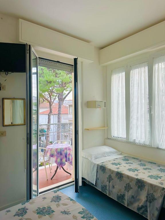 Postel nebo postele na pokoji v ubytování Hotel Erika