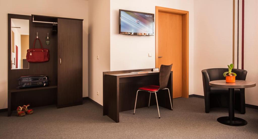 TV a/nebo společenská místnost v ubytování GS Hotel