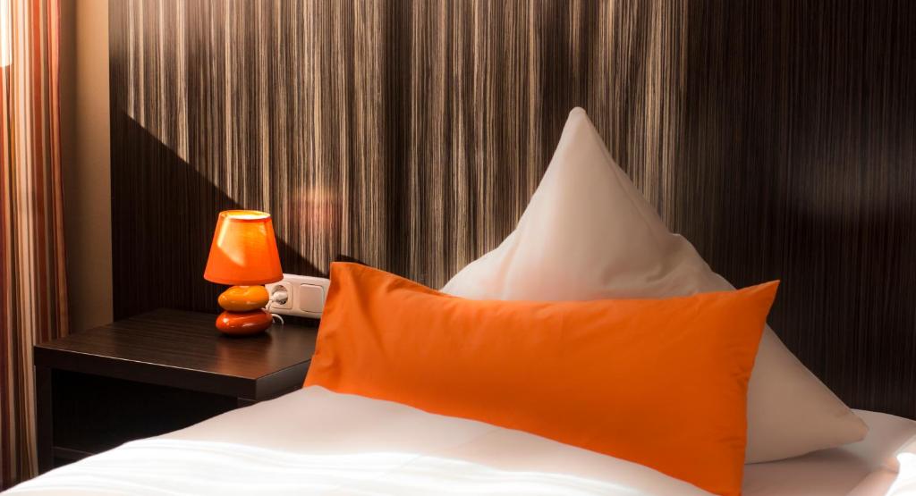 Postel nebo postele na pokoji v ubytování GS Hotel