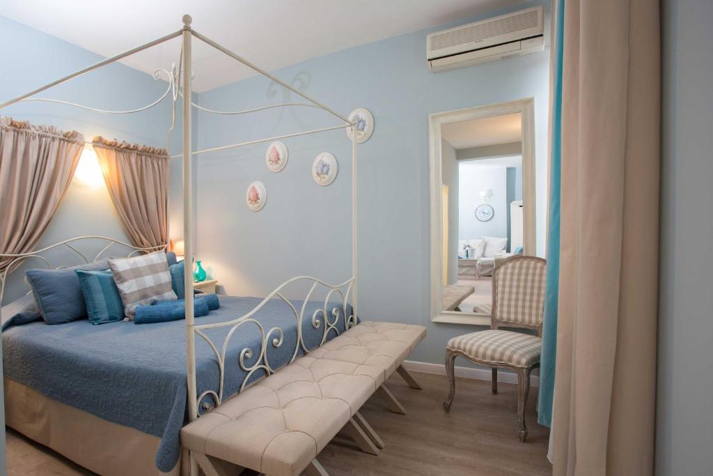 a bedroom with a canopy bed and a mirror at Family hotel The Castle in Shumen