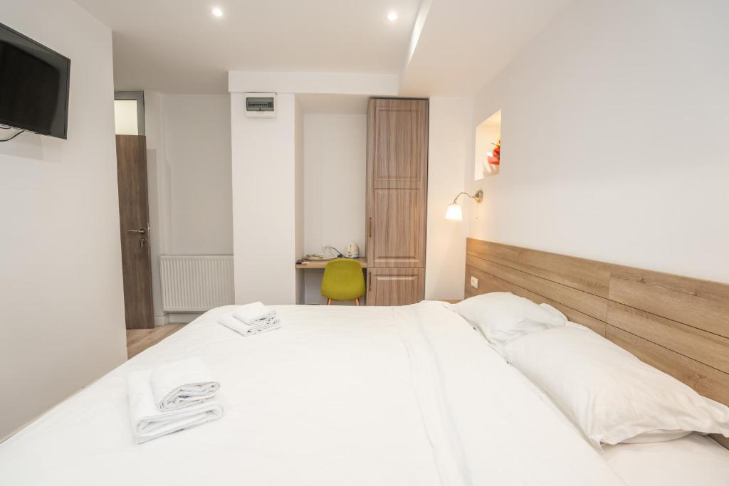 Postel nebo postele na pokoji v ubytování Hotel Liad City Center