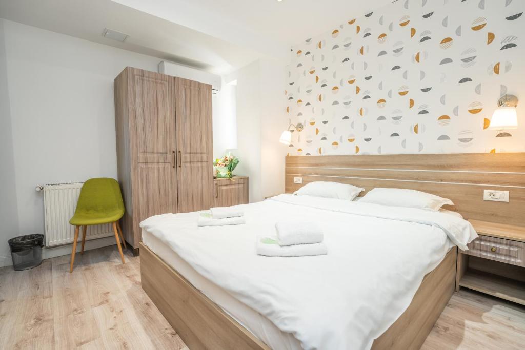 Postel nebo postele na pokoji v ubytování Hotel Liad City Center
