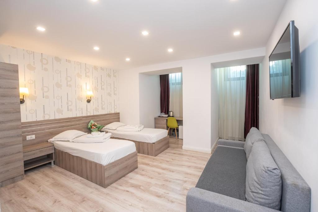 TV a/nebo společenská místnost v ubytování Hotel Liad City Center