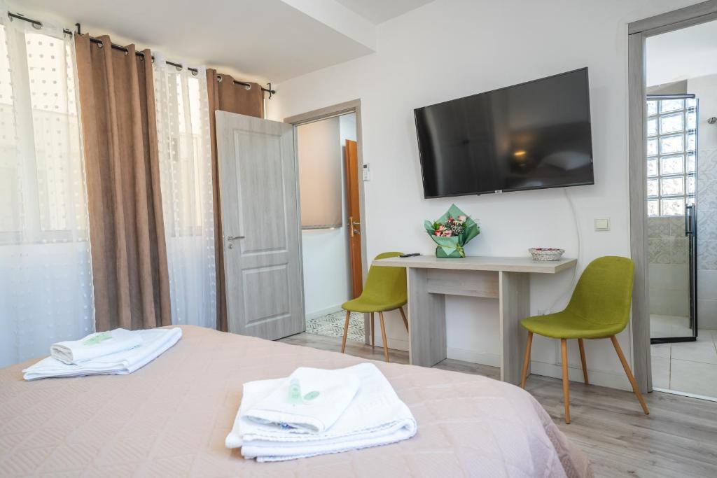 TV a/nebo společenská místnost v ubytování Hotel Liad City Center
