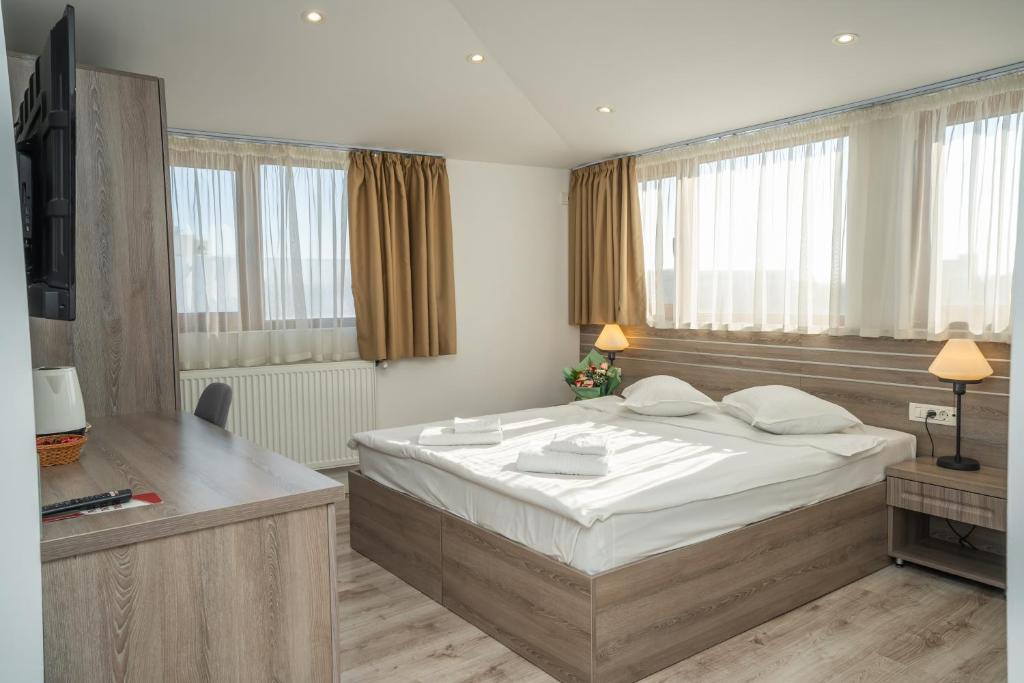 Postel nebo postele na pokoji v ubytování Hotel Liad City Center