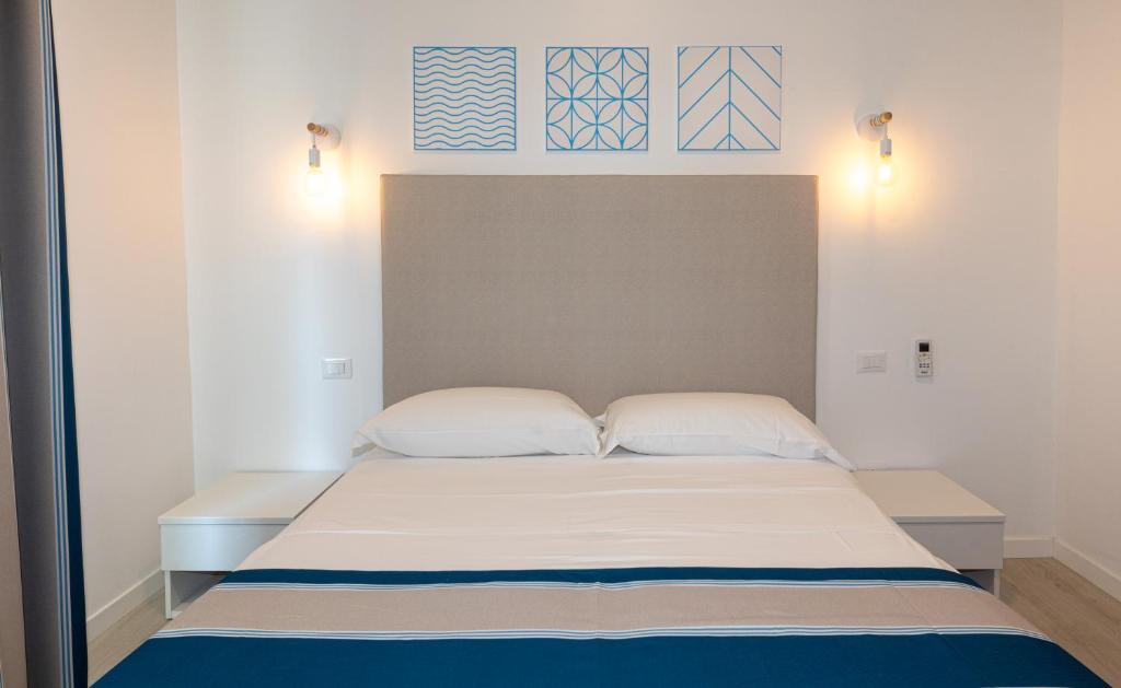 Postel nebo postele na pokoji v ubytování Hotel Paolina