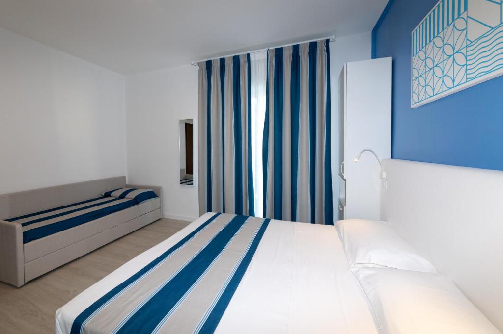 Postel nebo postele na pokoji v ubytování Hotel Paolina