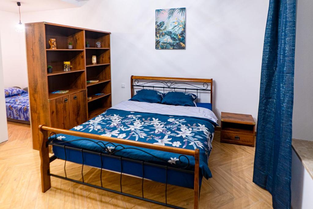 Ένα ή περισσότερα κρεβάτια σε δωμάτιο στο Apartamenty LUX Słowackiego, Przemyśl