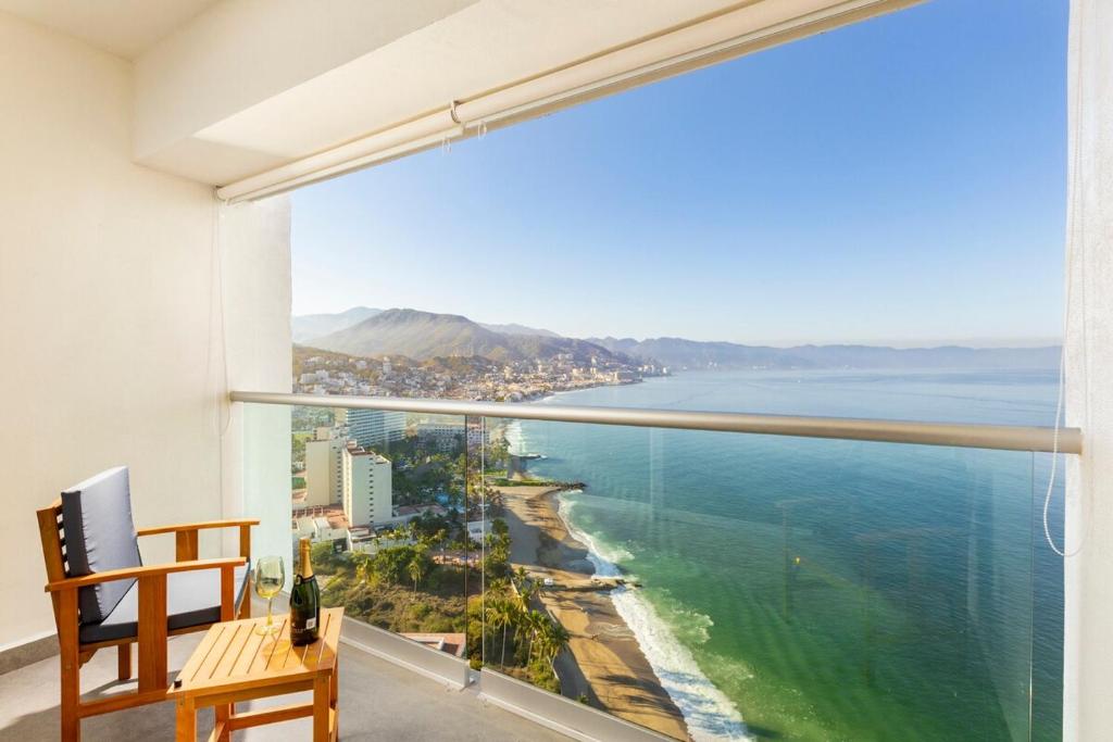 a room with a view of the ocean at Harbor NT2505 by Moikkarentals in Puerto Vallarta