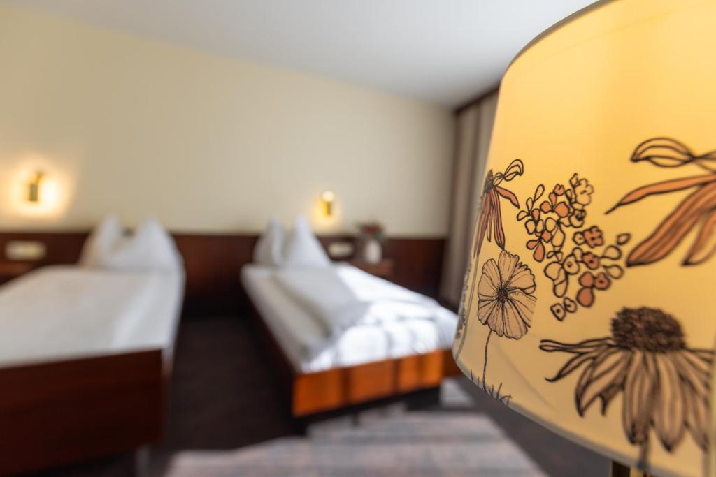 A bed or beds in a room at Hotel Katharinenhof STANDARD