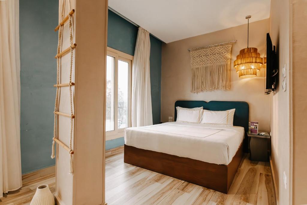 Postel nebo postele na pokoji v ubytování Almas Pyramids View Hotel