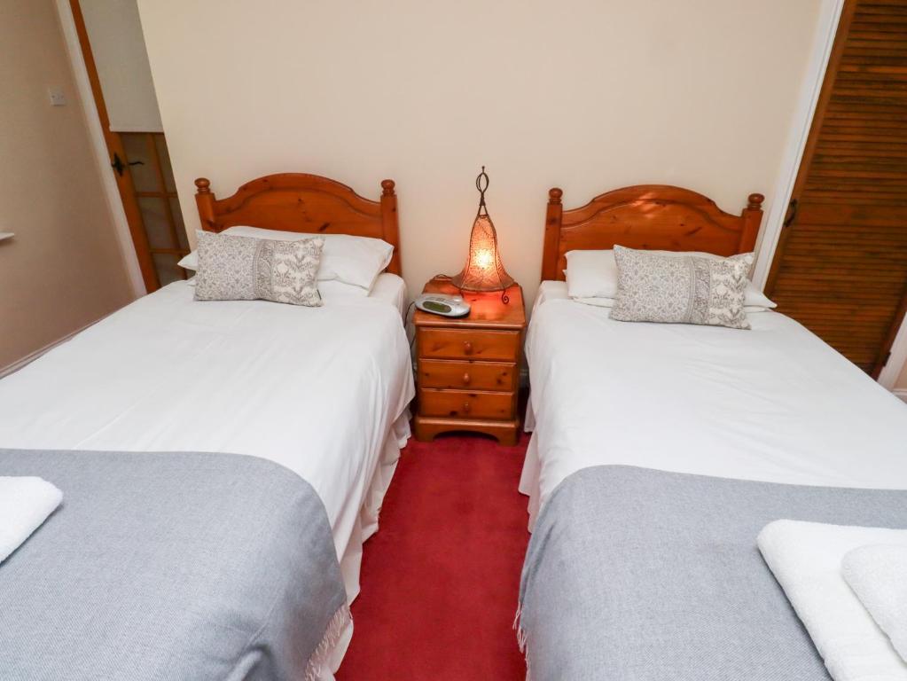 Postel nebo postele na pokoji v ubytování Rose Cottage