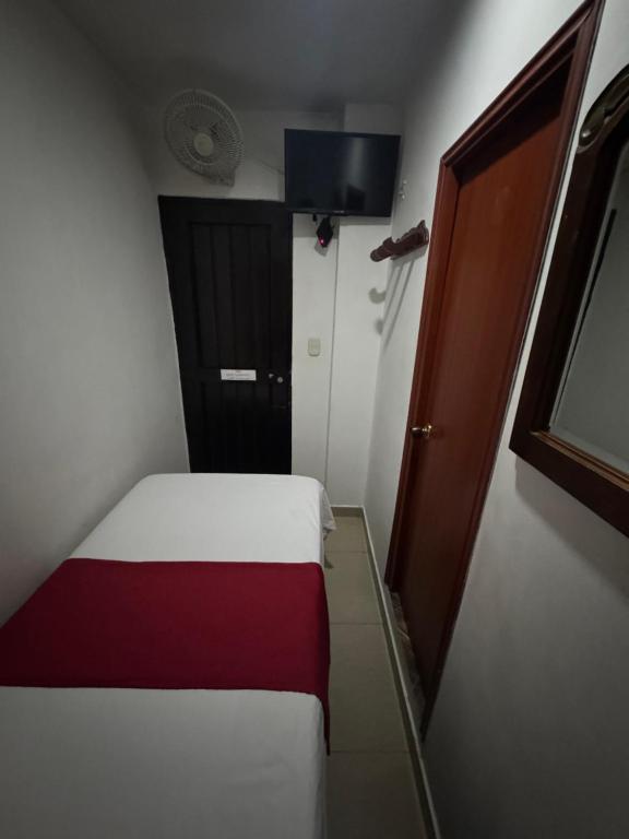 Postel nebo postele na pokoji v ubytování Hotel Tucan Pereira