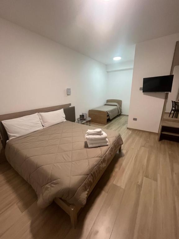 Postel nebo postele na pokoji v ubytování B&B La Terrazza Polifrone