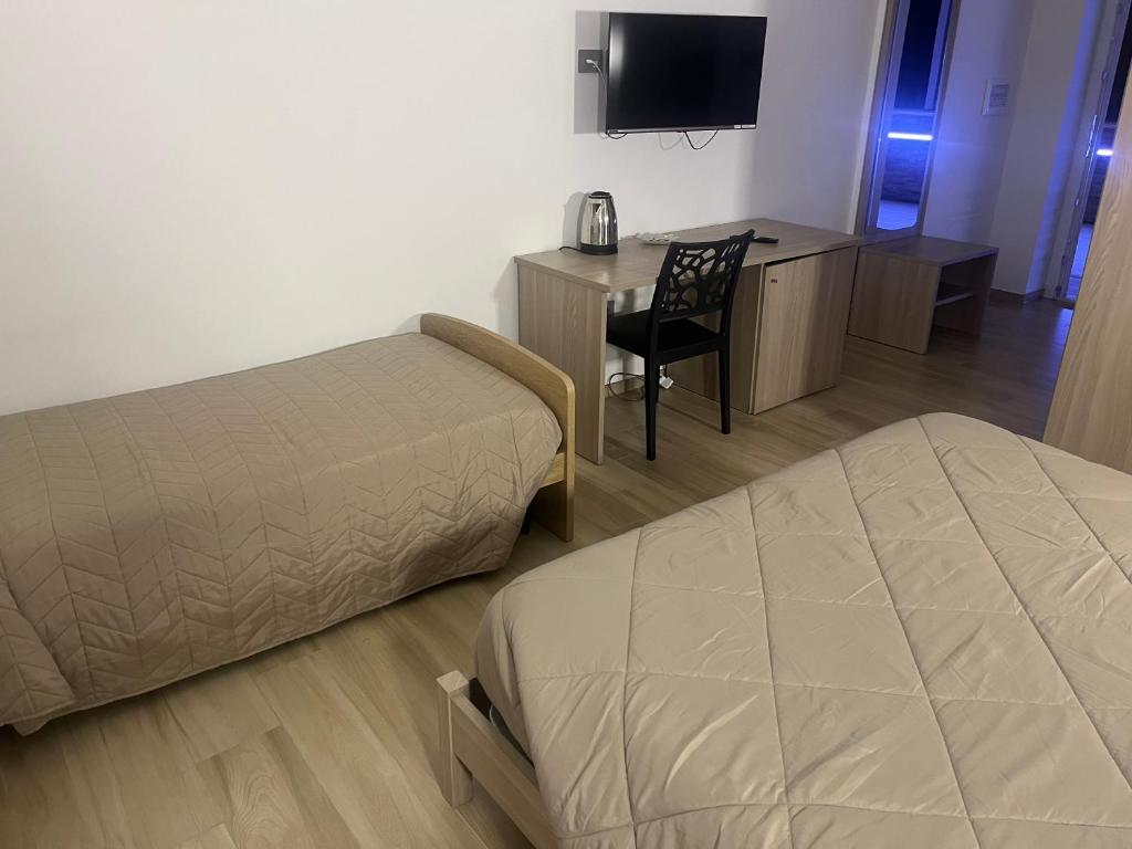 Postel nebo postele na pokoji v ubytování B&B La Terrazza Polifrone