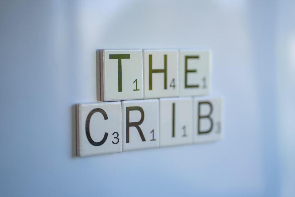 a group of cubes with the words the game on them at The Crib Haven - Te Anau Holiday Home in Te Anau