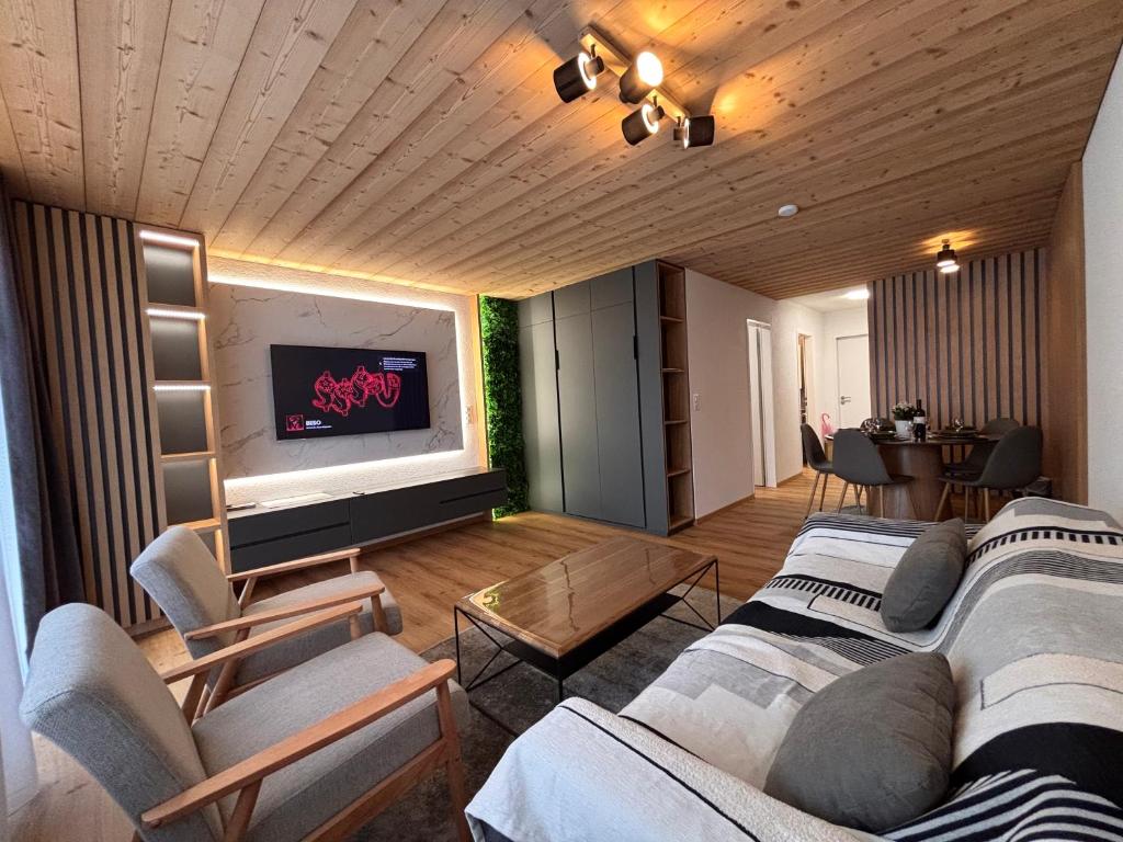 Posezení v ubytování Luxuse Ferienwohnung Flüe 11