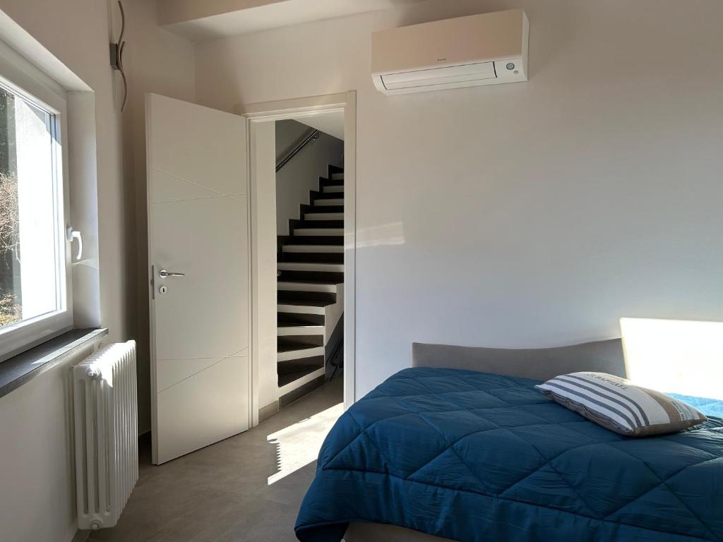 Postel nebo postele na pokoji v ubytování El Fossadeu-Biassa-Cinque Terre