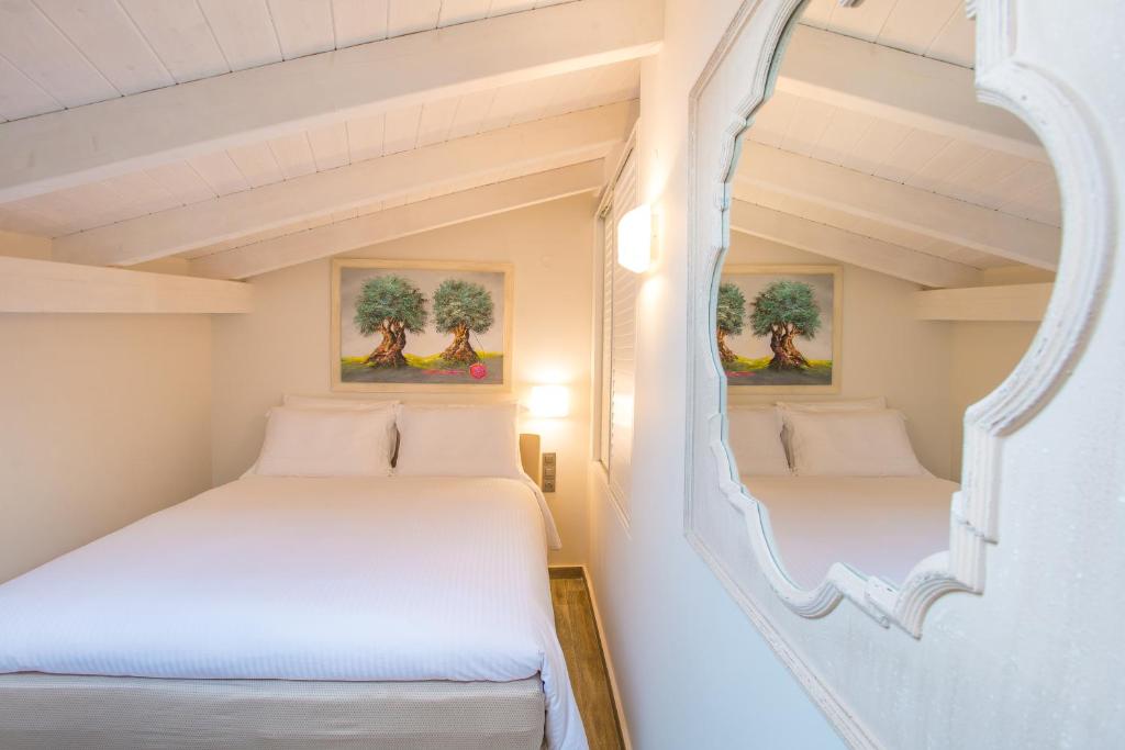 Ένα ή περισσότερα κρεβάτια σε δωμάτιο στο Villa Vilielmini