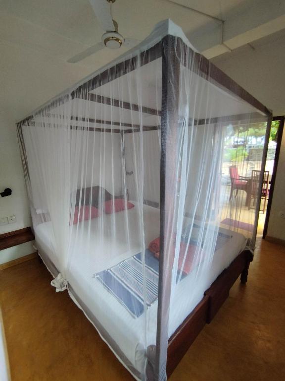 Postel nebo postele na pokoji v ubytování Tropical Garden