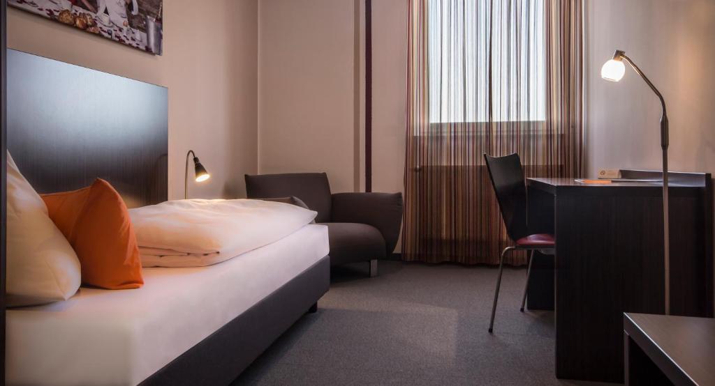 Postel nebo postele na pokoji v ubytování GS Hotel